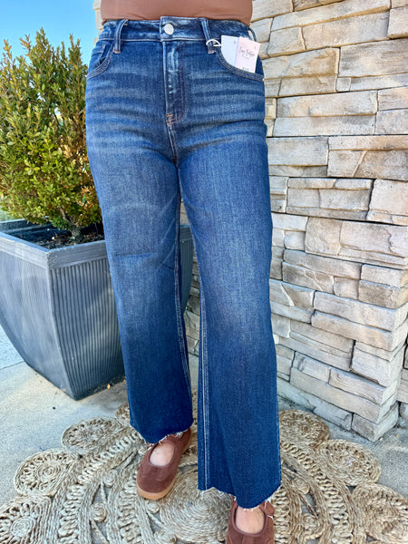 women wearing high rise cropped medium washed jeans
