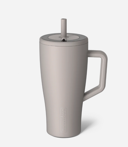 mocha mug with a lid and straw on a white background
