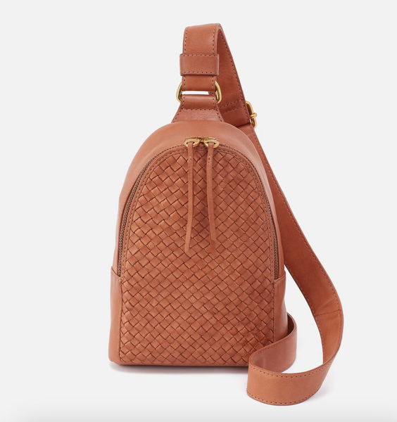 Brown woven leather sling bag on a white background