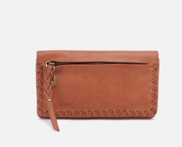 Brown leather wallet with a strap on a light gray background