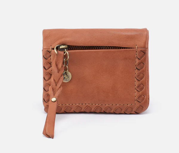 Brown leather wallet with decorative strap and gold accents on a white background